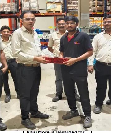A colleague being presented with a recognition award