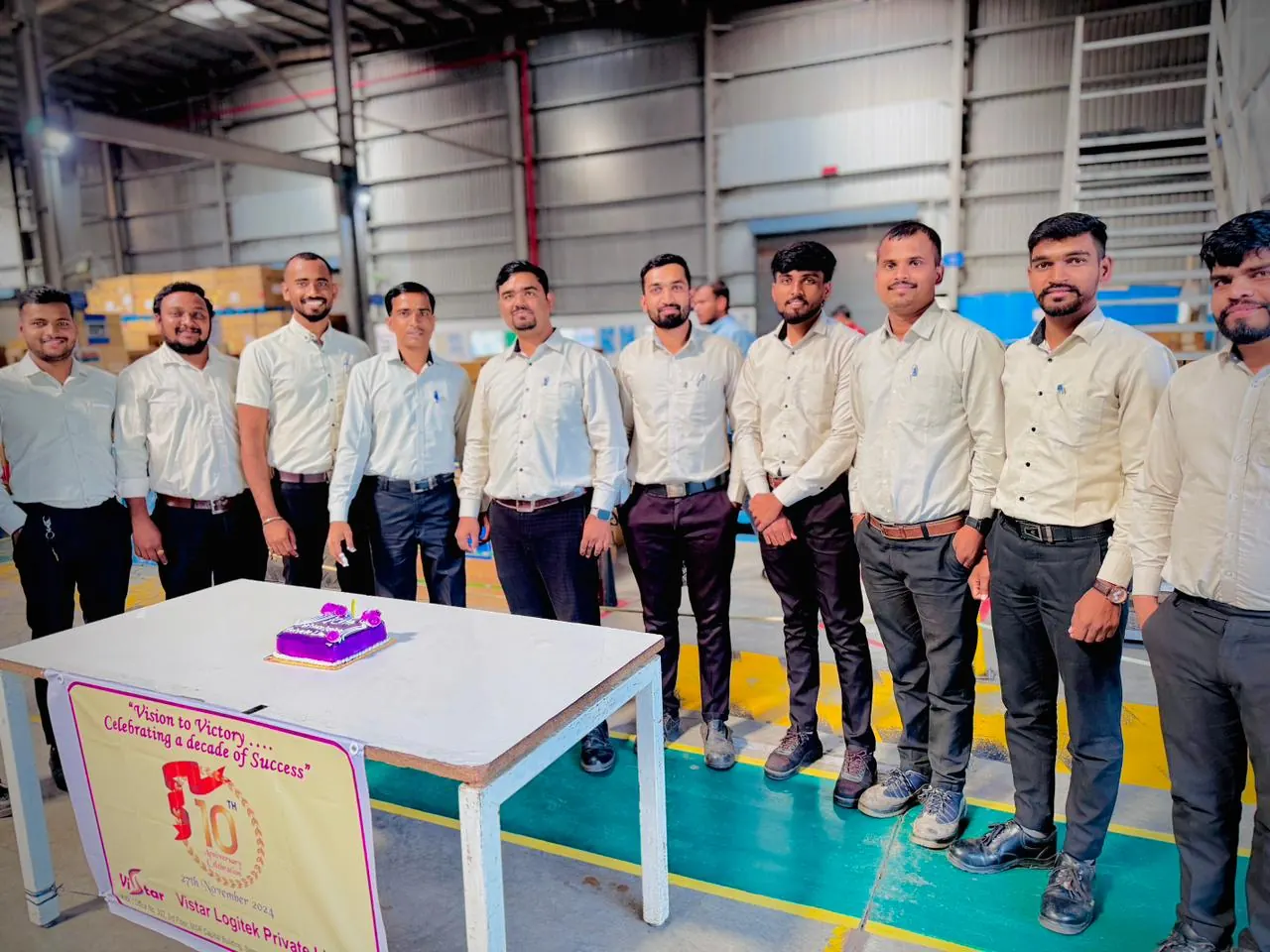Warehouse team gathered for a celebration on the operations floor